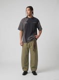 DAXUEN Asymmetrical panel t-shirt in charcoal grey and dark waffle knit — model photo