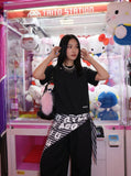 DAXUEN Asymmetrical snap button short-sleeved T-shirt — model photo