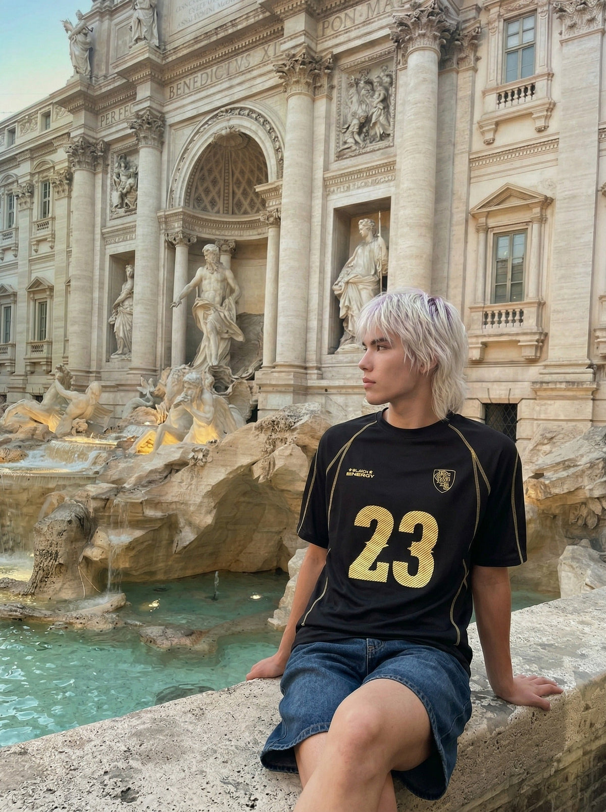 DAXUEN Athletic Energy Graphic T-Shirt with numeral and text graphics — model photo