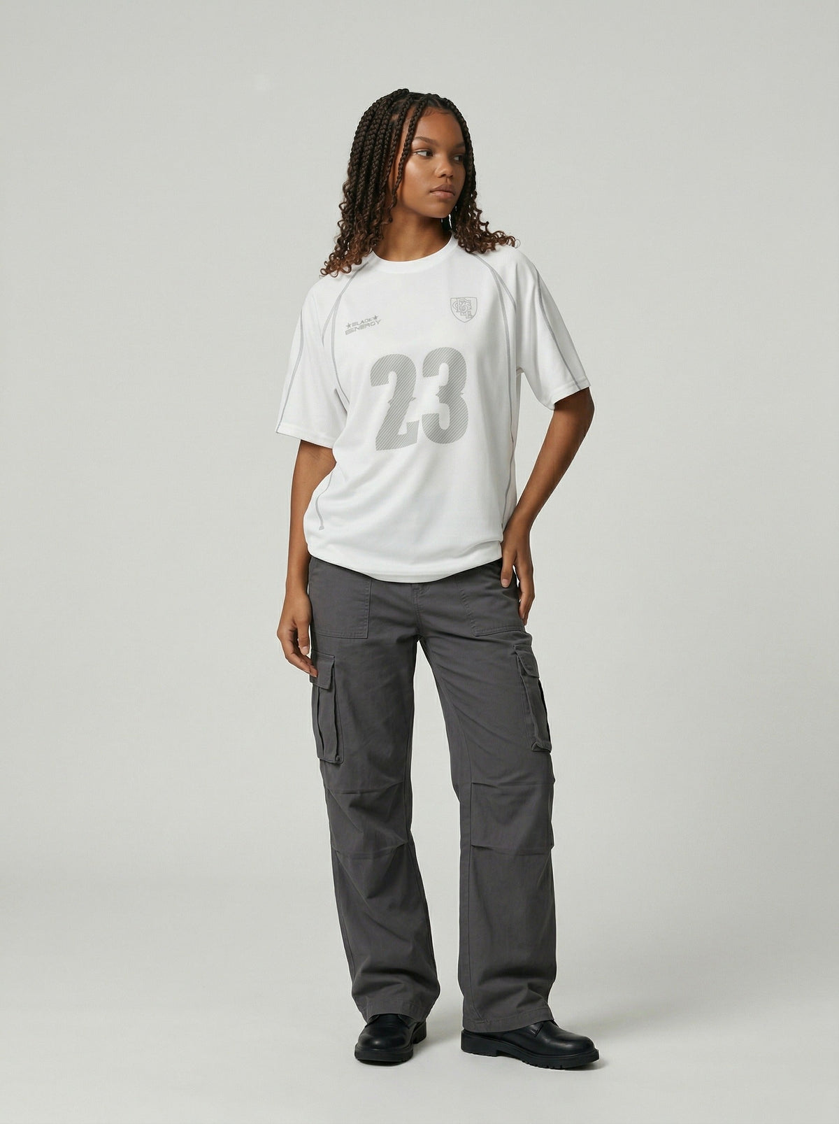 DAXUEN Athletic Energy Graphic T-Shirt with numeral and text graphics — model photo