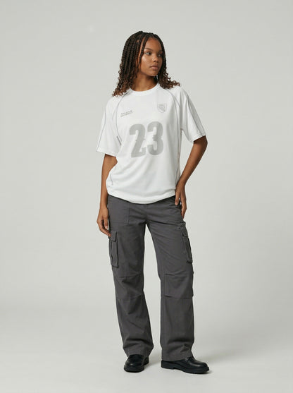 DAXUEN Athletic Energy Graphic T-Shirt with numeral and text graphics — model photo