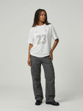 DAXUEN Athletic Energy Graphic T-Shirt with numeral and text graphics — model photo