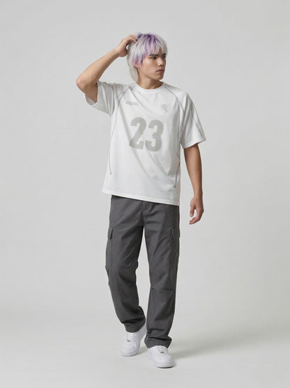 DAXUEN Athletic Energy Graphic T-Shirt with numeral and text graphics — model photo