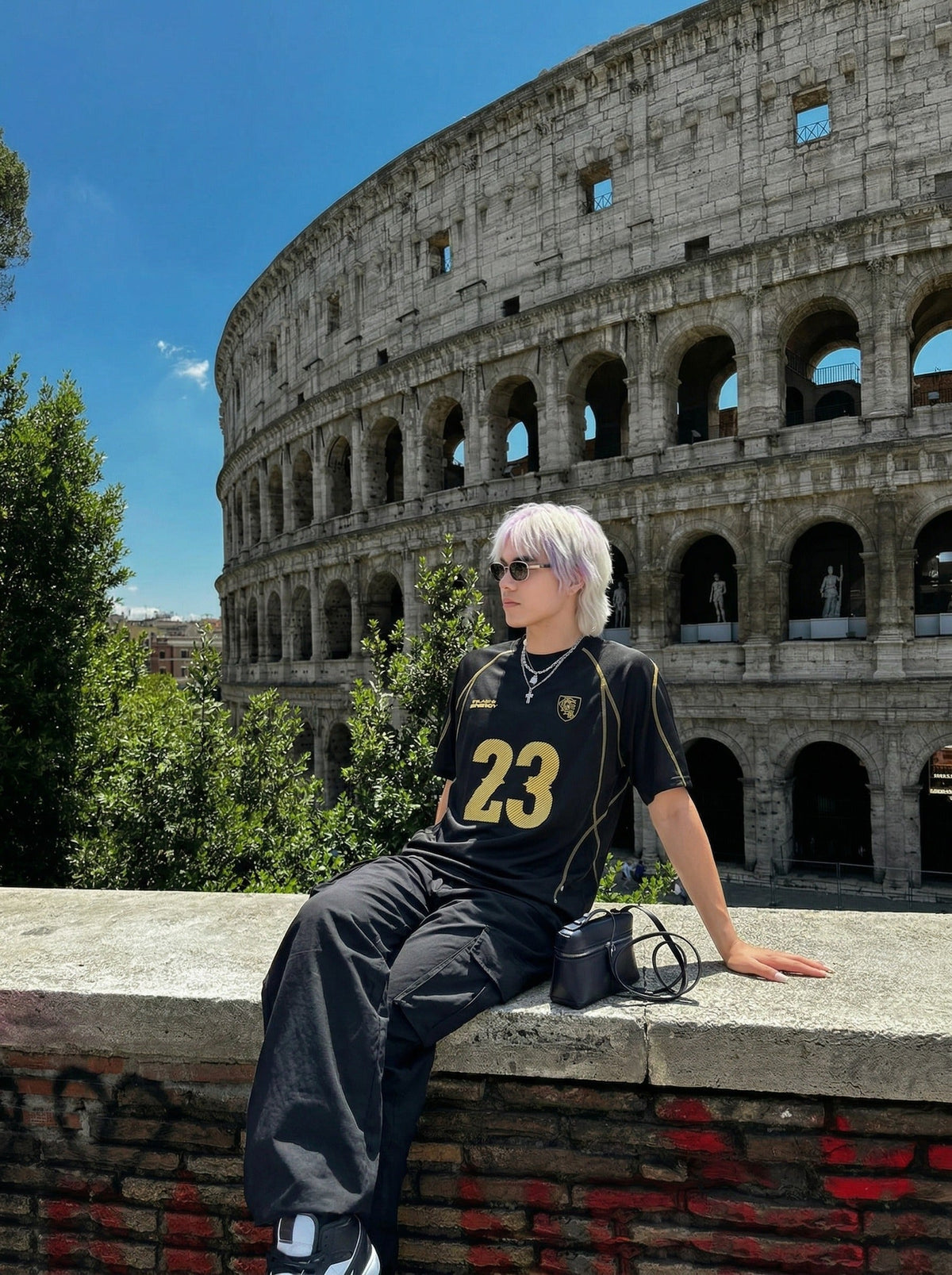DAXUEN Athletic Energy Graphic T-Shirt with numeral and text graphics — model photo