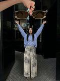 DAXUEN High-waisted wide-leg cargo pants with acid-wash effect — model photo
