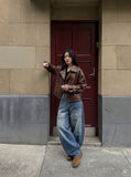 DAXUEN Baggy denim jeans with wide-leg silhouette and raw edge details — model photo