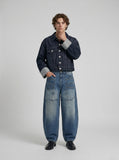 DAXUEN Baggy denim jeans with wide-leg silhouette and raw edge details — model photo