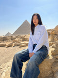 DAXUEN Baggy denim jeans with wide-leg silhouette and raw edge details — model photo