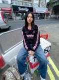 DAXUEN Baggy denim jeans with wide-leg silhouette and raw edge details — model photo