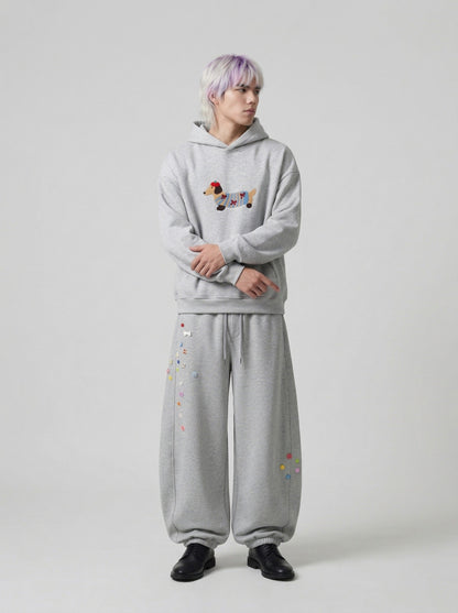 DAXUEN Baggy graphic sweatpants with colorful motifs — model photo