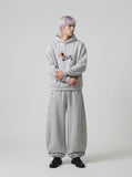 DAXUEN Baggy graphic sweatpants with colorful motifs — model photo