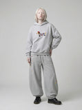 DAXUEN Baggy graphic sweatpants with colorful motifs — model photo