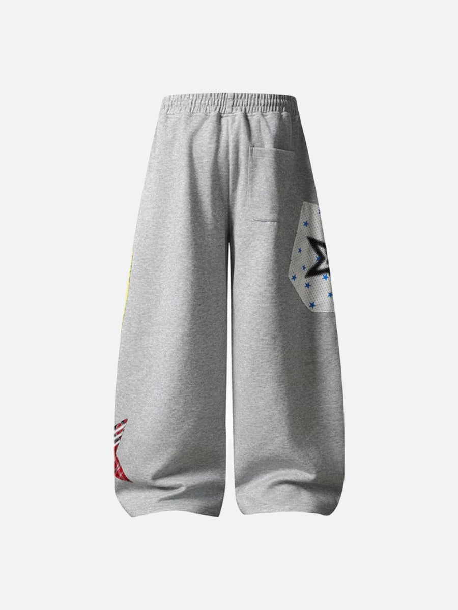 Grey wide-leg sweatpants with patchwork designs
