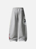 Grey wide-leg sweatpants with patchwork designs