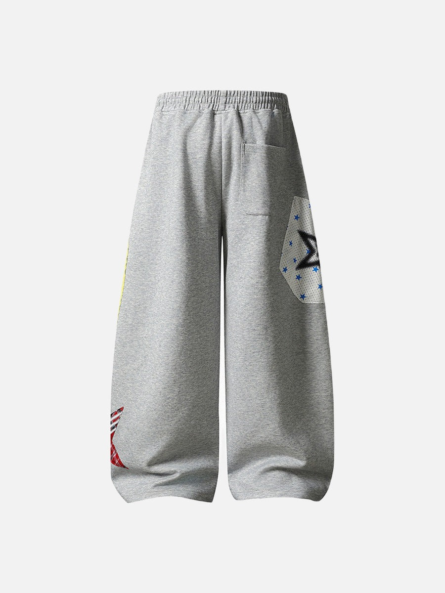 Grey wide-leg sweatpants with patchwork designs