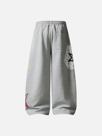 Grey wide-leg sweatpants with patchwork designs