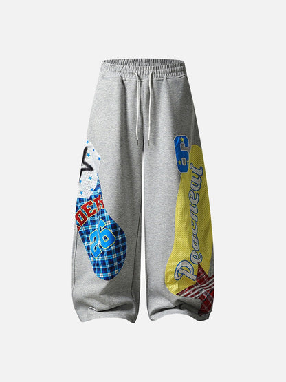 Grey wide-leg sweatpants with patchwork designs