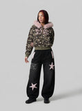 DAXUEN Baggy track pants with star appliqués and elastic waistband — model photo
