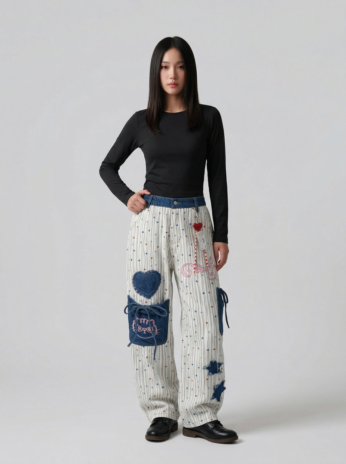 DAXUEN Wide-leg striped pants with patches and embroidery — model photo