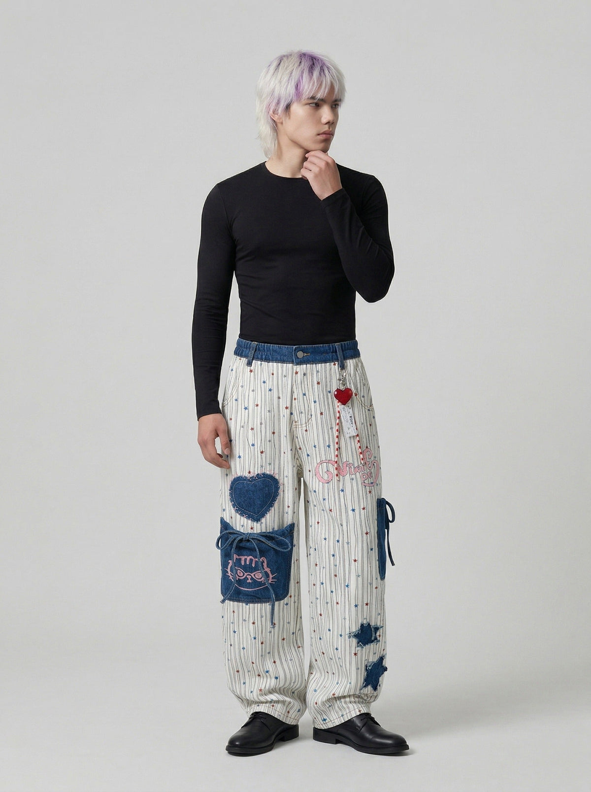 DAXUEN Wide-leg striped pants with patches and embroidery — model photo