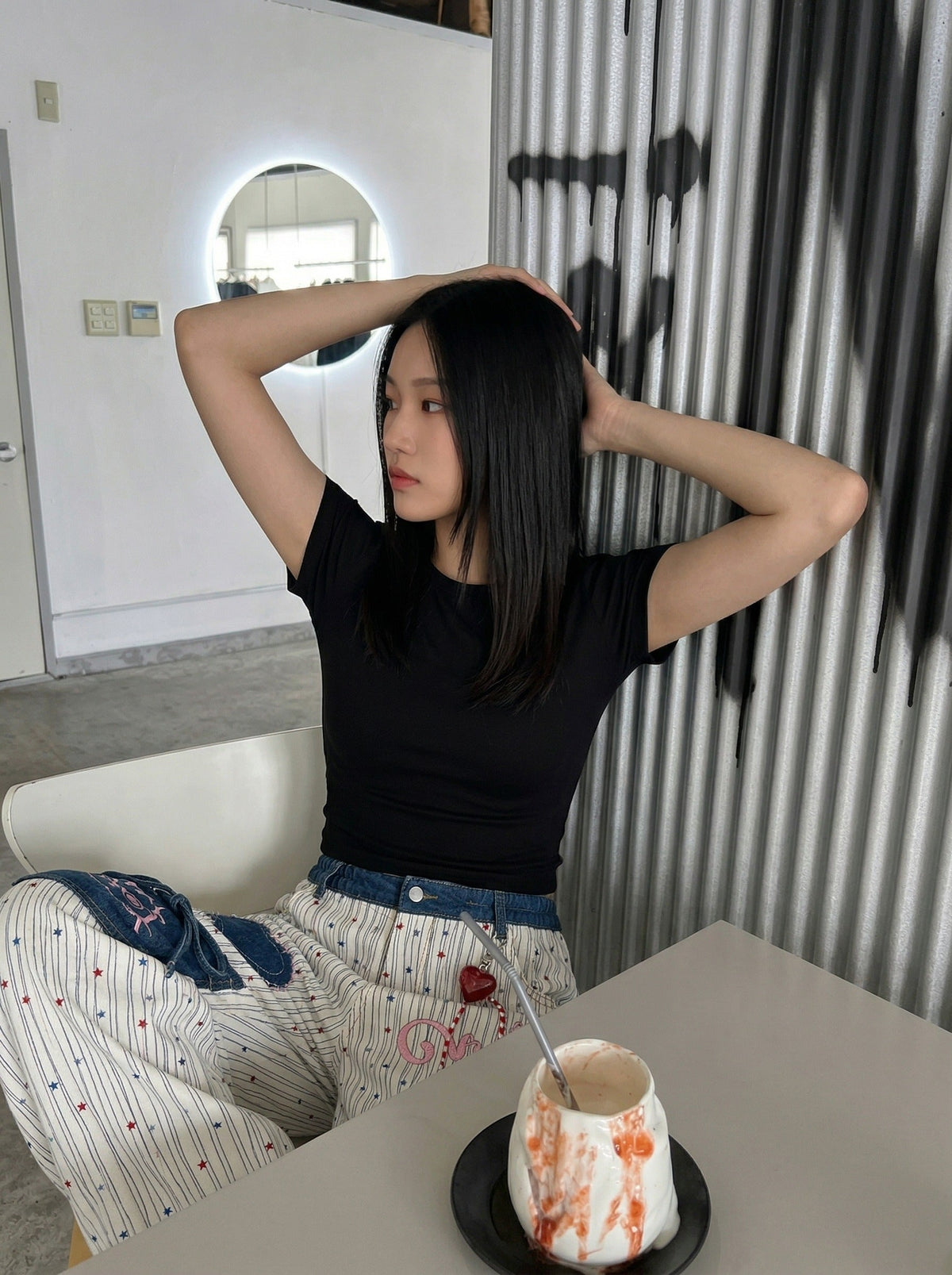 DAXUEN Wide-leg striped pants with patches and embroidery — model photo