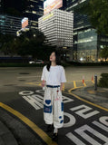 DAXUEN Wide-leg striped pants with patches and embroidery — model photo
