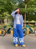 DAXUEN Wide-leg baggy trousers with star graphics — model photo
