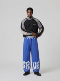 DAXUEN Wide-leg baggy trousers with star graphics — model photo