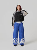 DAXUEN Wide-leg baggy trousers with star graphics — model photo
