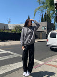 DAXUEN Men's baggy wide-leg pants in dark brown and black — model photo