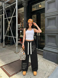 DAXUEN Baggy wide-leg pants with script prints — model photo
