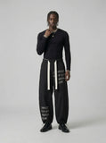 DAXUEN Baggy wide-leg pants with script prints — model photo