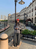 DAXUEN Baggy wide-leg trousers with curved seams — model photo