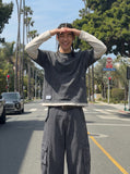 DAXUEN Wide-leg balloon-leg cargo pants in olive green and charcoal grey — model photo