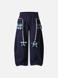 Loose-fitting balloon pants with plaid details