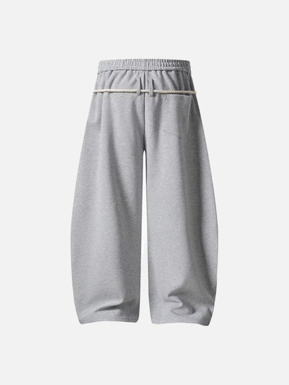 Loose-fitting balloon pants with plaid details