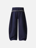 Loose-fitting balloon pants with plaid details