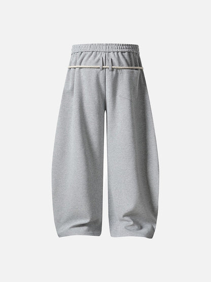 Loose-fitting balloon pants with plaid details