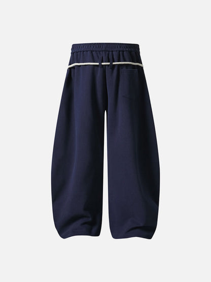 Loose-fitting balloon pants with plaid details