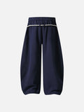 Loose-fitting balloon pants with plaid details