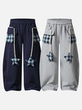 Loose-fitting balloon pants with plaid details