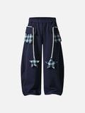 Loose-fitting balloon pants with plaid details