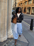 DAXUEN Wide-leg balloon pants with sash and embroidery — model photo