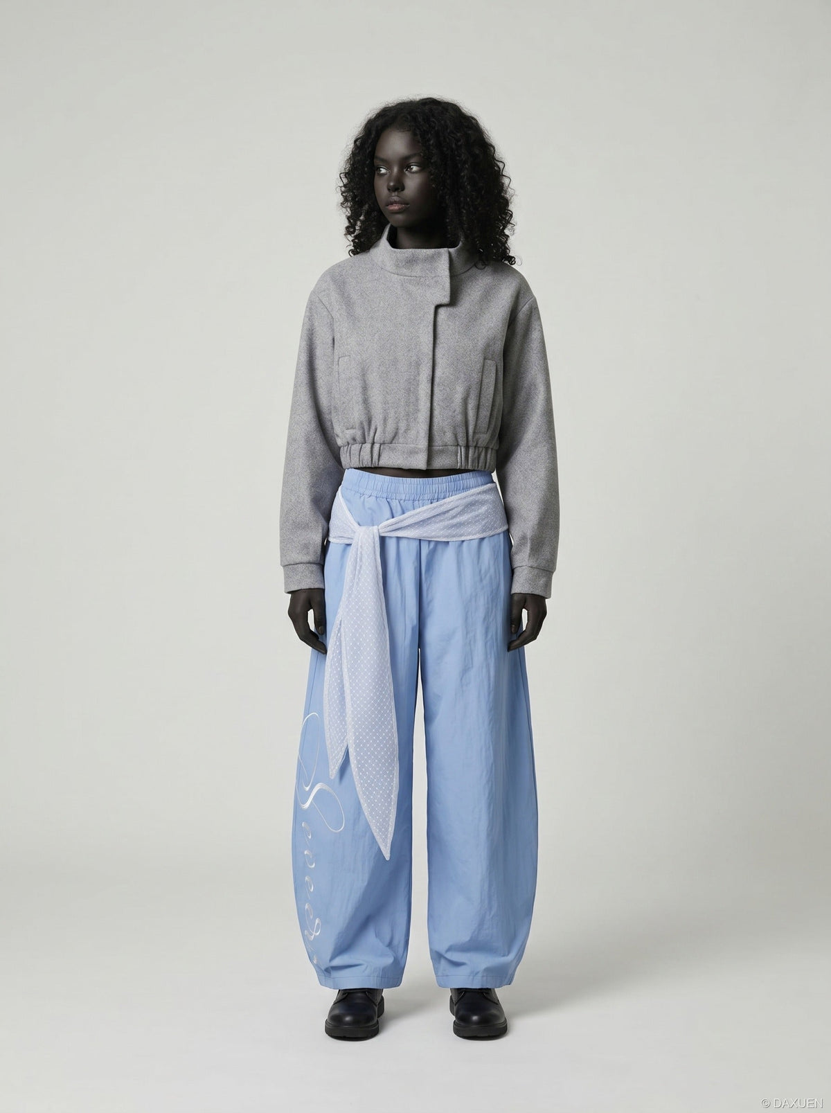 DAXUEN Wide-leg balloon pants with sash and embroidery — model photo