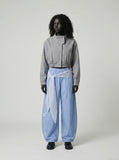 DAXUEN Wide-leg balloon pants with sash and embroidery — model photo