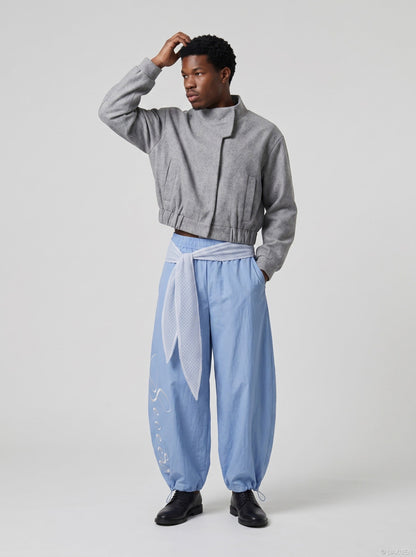 DAXUEN Wide-leg balloon pants with sash and embroidery — model photo