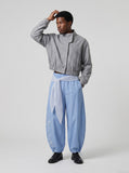 DAXUEN Wide-leg balloon pants with sash and embroidery — model photo