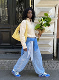DAXUEN Wide-leg balloon pants with sash and embroidery — model photo