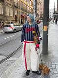 DAXUEN Loose-fitting wide-leg track pants with red graphics — model photo