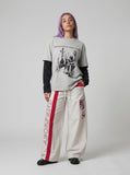 DAXUEN Loose-fitting wide-leg track pants with red graphics — model photo